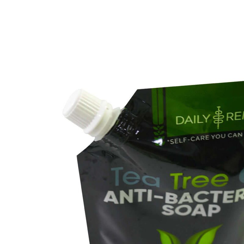 Close up of white screw cap on plastic liquid spout pouch