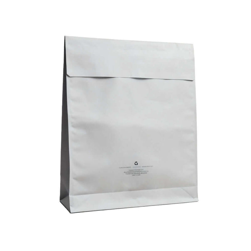 Opaque plastic mailing bag with peel and seal closure