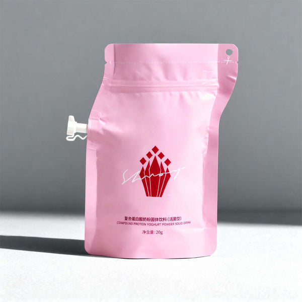 Pink stand up zipper spout pouch with side spout on grey background