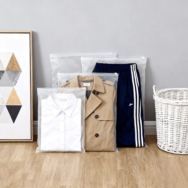 large frosted pe garment zipper bags standing on wooden floor