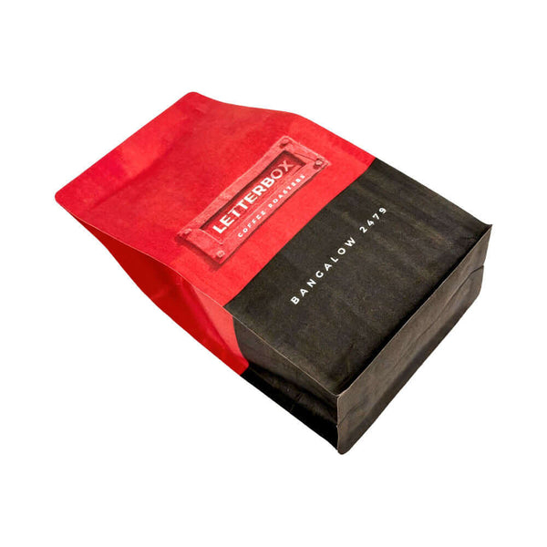 Bottom view square bottom kraft coffee bag with red and black exterior